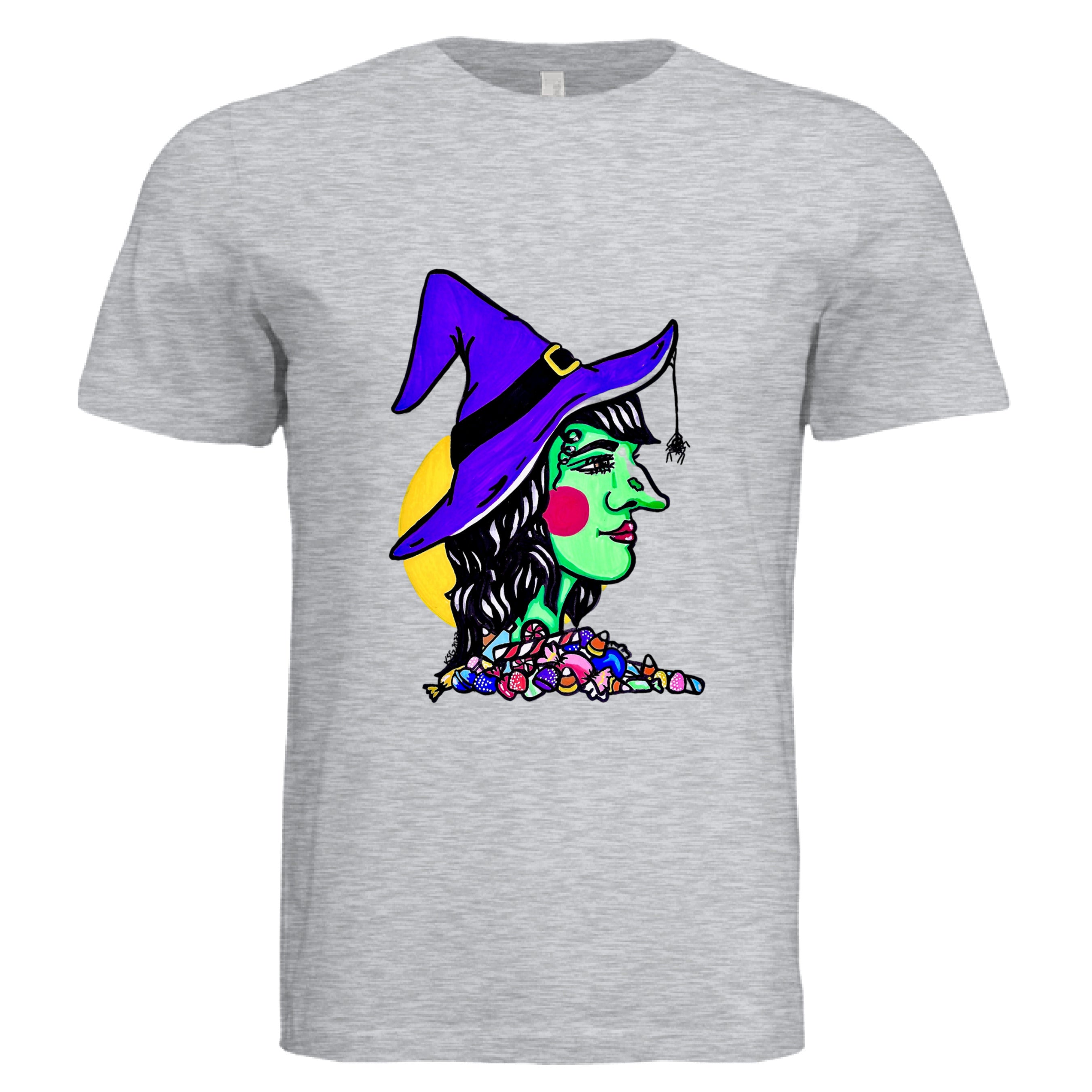 This is the Ash Witch T-Shirt by Storm Garden Studio. This is showcasing from the front. The illustration is of a green skinned witch facing te right, purple witch hat with spider coming down, bright red circular cheeks and red lips, black wavy hair with assorted candies below her neck. There are candy corns, jelly, peppermints, stix in all differentcolors. The background is a bright yellow circle behind the back end of her head. The shirt is against a white background.