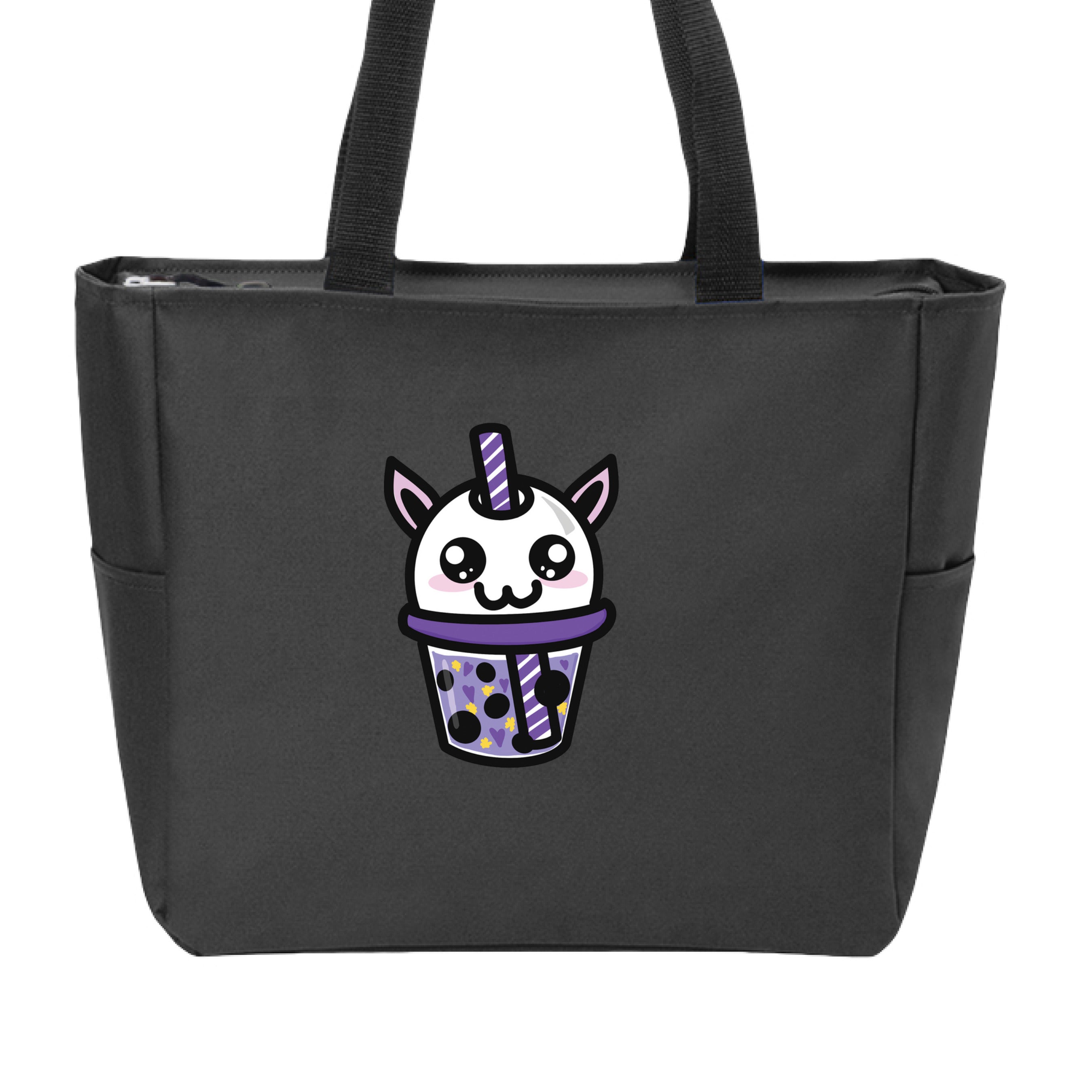 This is the Black Cryptid Boba Zip Tote by Dazzle & Daggers Design. This is showcasing the front and the handles are black. The Cryptid Boba is white, has cute light pink oval cheeks under big black and white sparkly eyes. It's mouth is in the shape of the number 3, purple and white swirl straw. In the glass is purple liquid, black boba, yellow stars and purple hearts. The tote is against a white background.