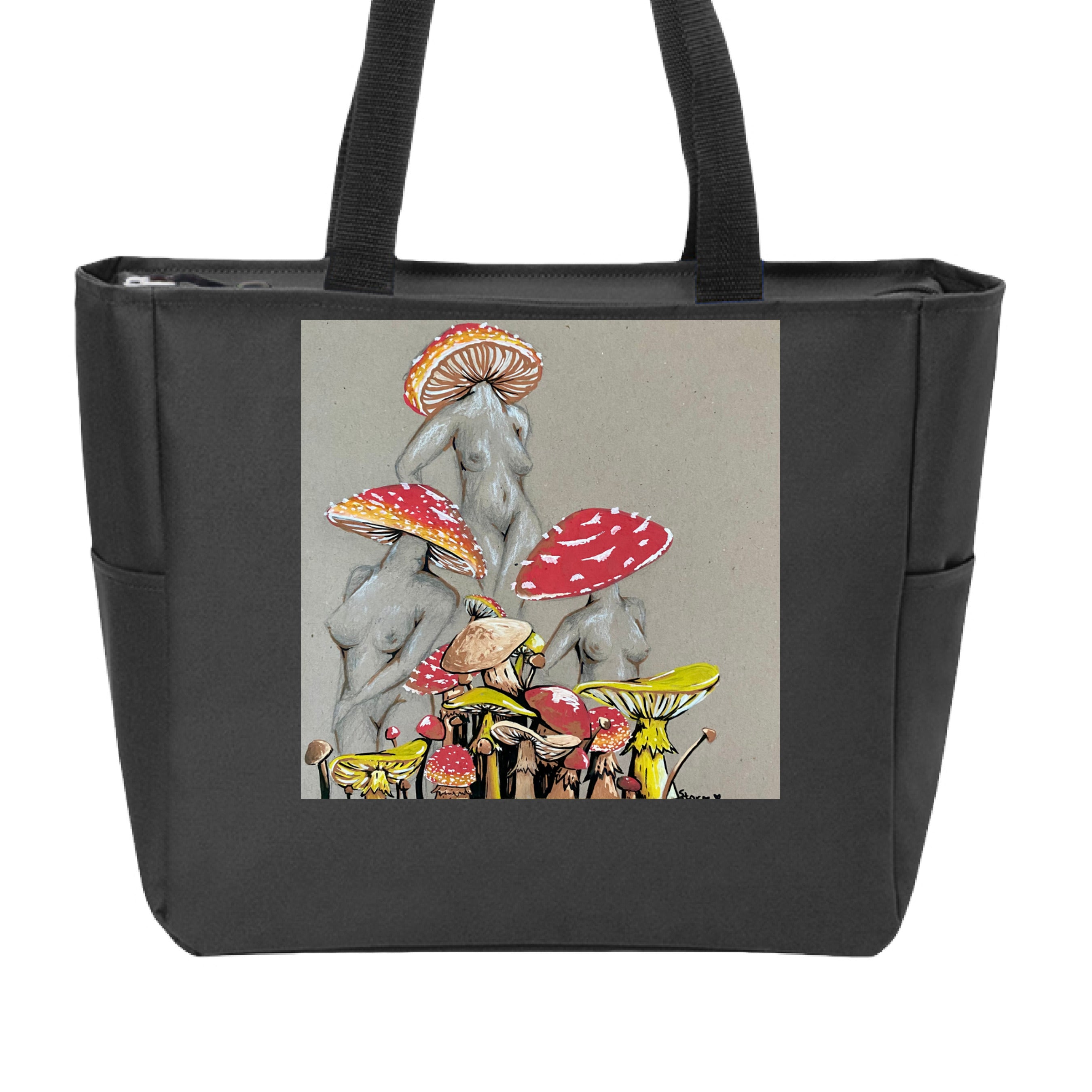 This is the Black Miss Amanita Zip Tote by Storm Garden Studio. This is showcasing the front. This illustration is on tan/grey background. There are three fusions of female human anatomy and mushroom fungi. Their heads are different styles of mushrooms, bodies are a gray/white outlined in brown. Below are different mushrooms and shapes with a mix of tan, red, white and yellow colors. The tote handles are black. It is against a white background.