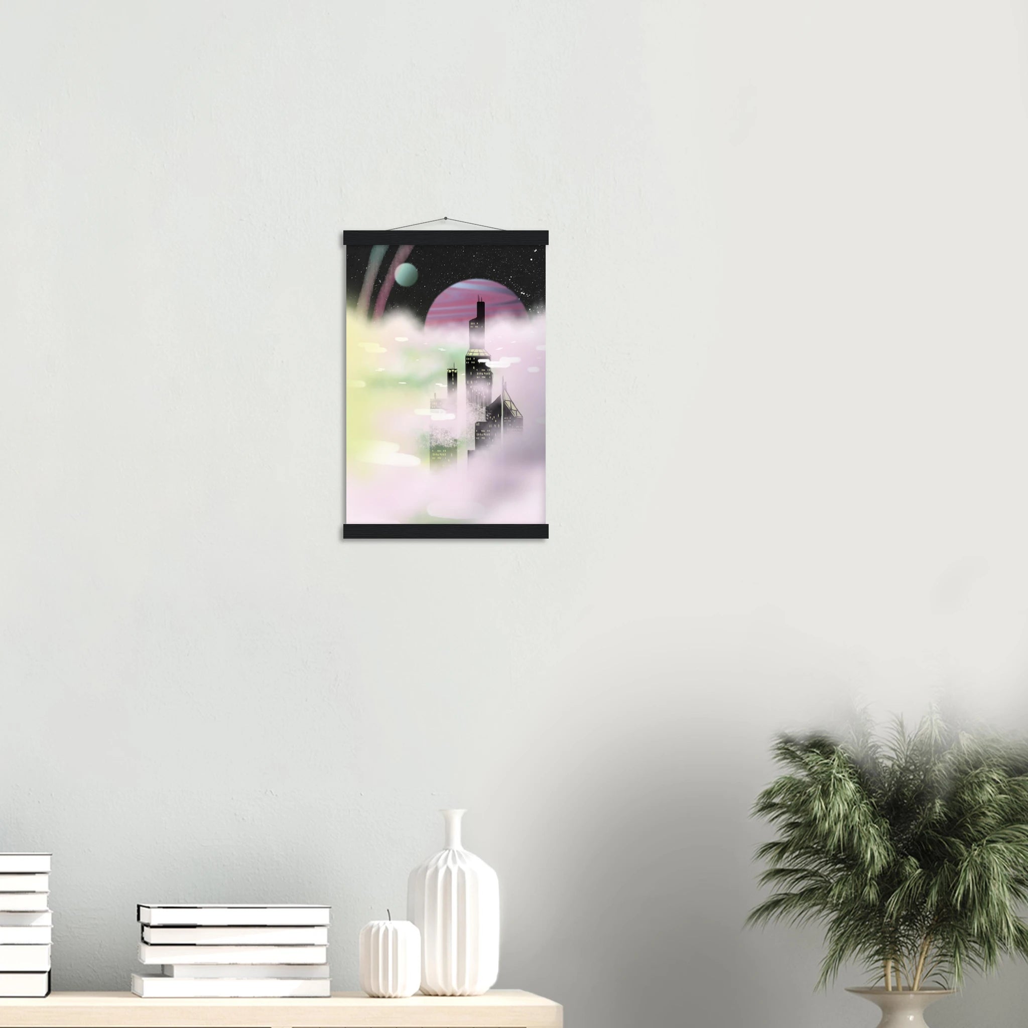 This is the Black 11" x 14" Space Environment Poster with Hanger by Chris Foster Design.It has a hanger attached to wood on the top.Wood on the bottom. The illustration blends the sharp geometry of towering buildings shadowed in black with yellow windows.Ethereal glow of planetary skies including a dark sky,white dots as stars,circular planet in light blue,pink/purple,streaks of blue/pink in the sky and drifting clouds with hues of green,pink and white. On a white wall,white decor,plant and shelving.