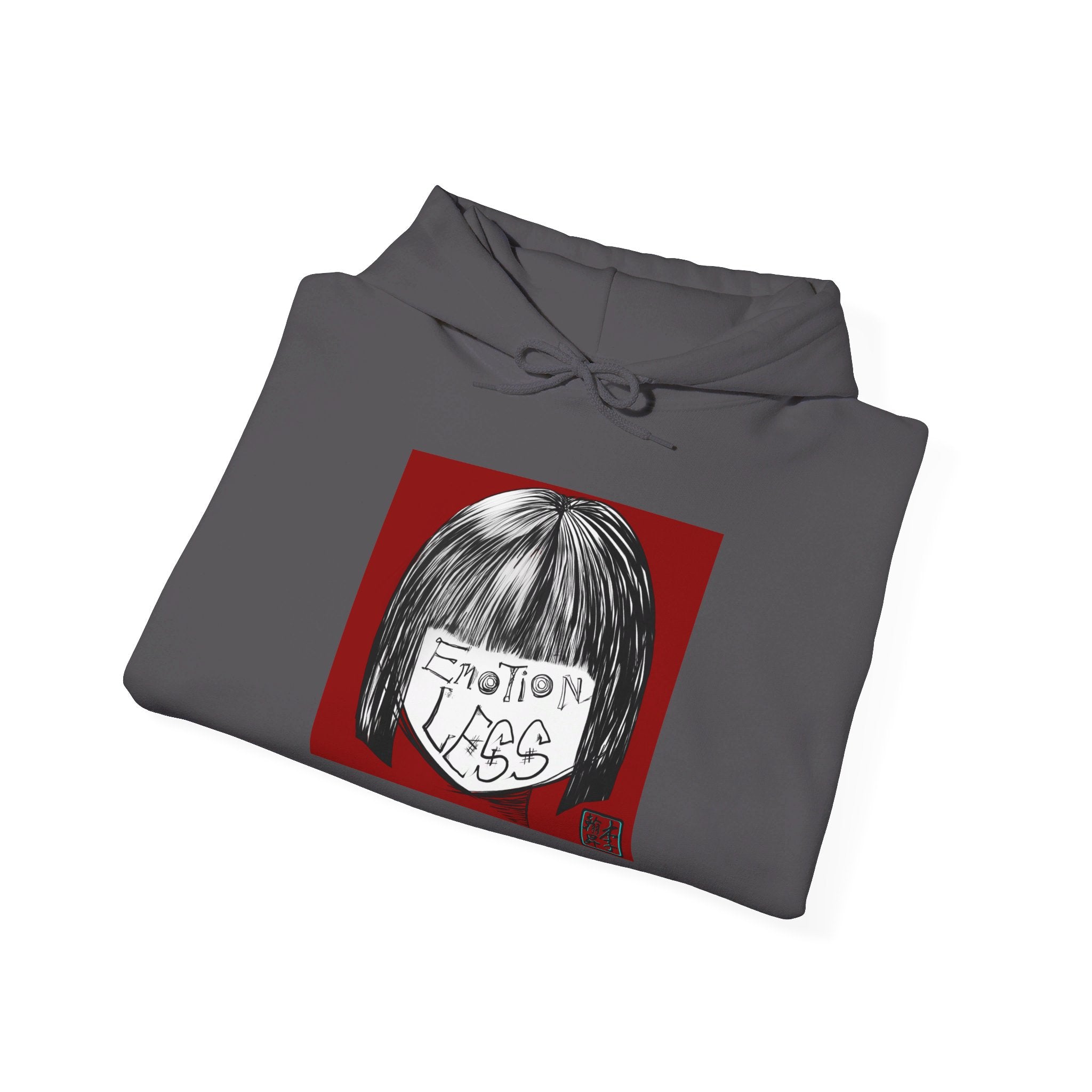 This is the Charcoal Emotionless Heavy Blend Hoodie by Lee Hansheng Studios. This is the image of the hoodie folded, drawstring in a bowtie that is colormatched. The illustration is squared in the middle, a black haired girl with bangs and her white face has the words, "Emotionless". Behind her is a red background and on the right of the illustration is the Lee Hansheng Studios logo outlined in blue. The image is against a white background.
