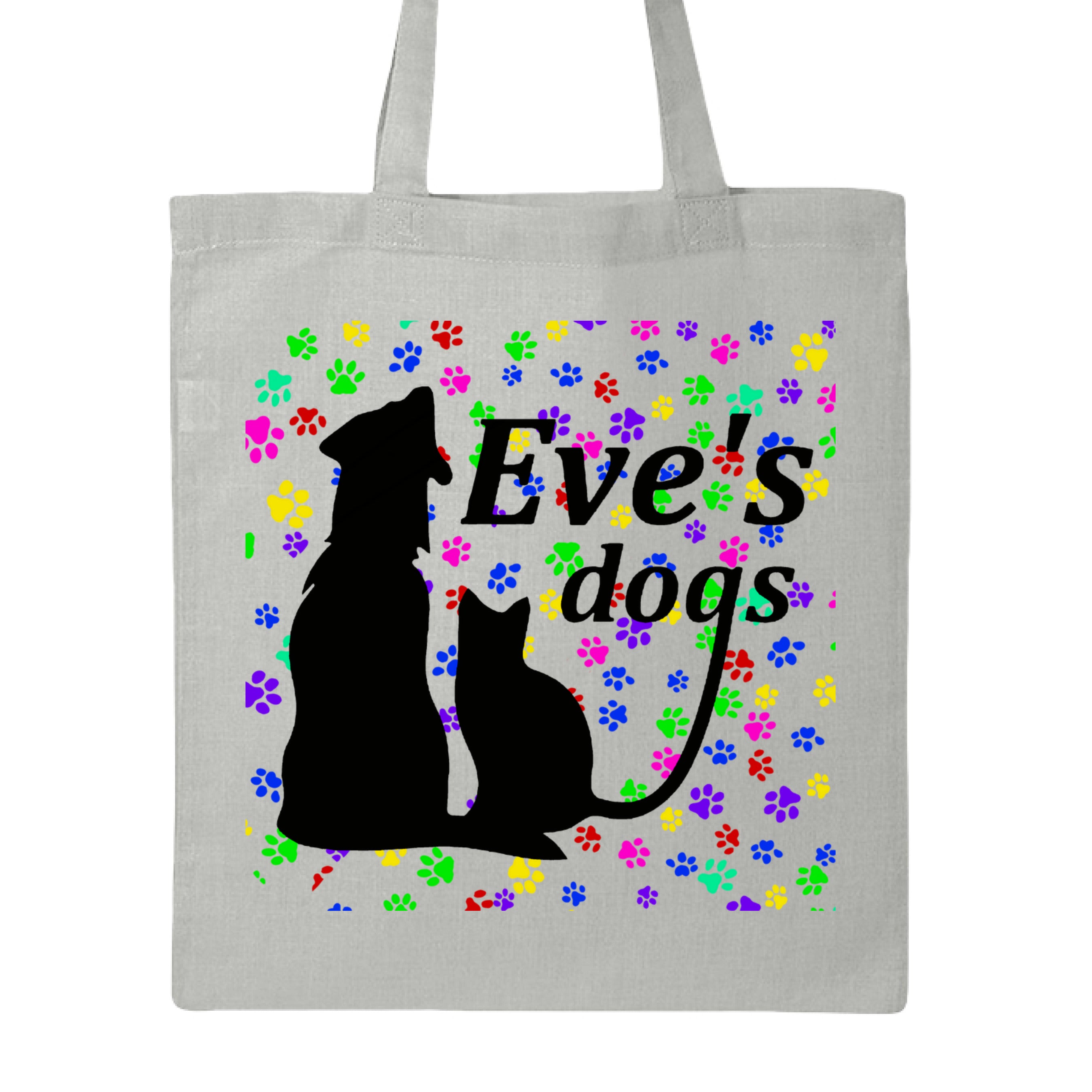 This is the Grey Paws on Paws Adopt Eve's Dogs Canvas Tote to help raise awareness and adopt. This is showcasing the front of the tote. There is an image of their logo which is in black writing of "Eve's Dogs". The "g" connects to the tail of the cat who is sitting next to the dog. Both are black shadows. The background is colorful paw prints which is bright green, blue pink, yellow and red. It is against a white background.