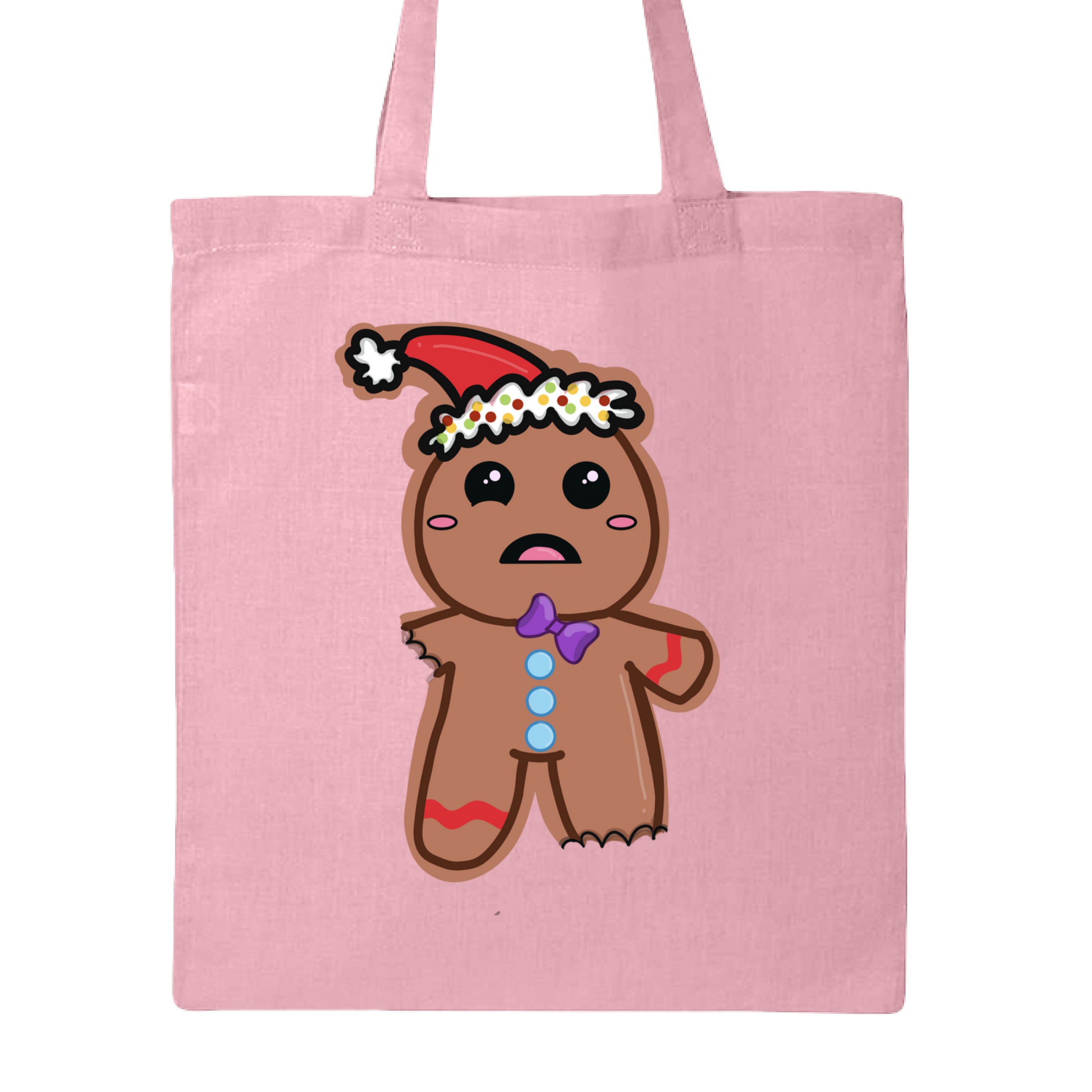 This is the Light Pink Ginger Bread,Ginger Dead Canvas Tote by Dazzle & Daggers Design.This is showcasing the back of the tote.The illustration is of a brown ginger bread who is wincing in pain.The left leg and right leg have been bitten off.It's wearing a santa hat with a white puff on the tip and around the hat.The puff around the hat is polka dotted with yellow,red and green.Gingerbread has oval pink cheeks,open mouth,pink tongue,slanted purple tie,three light blue bottons through the middle of the body.