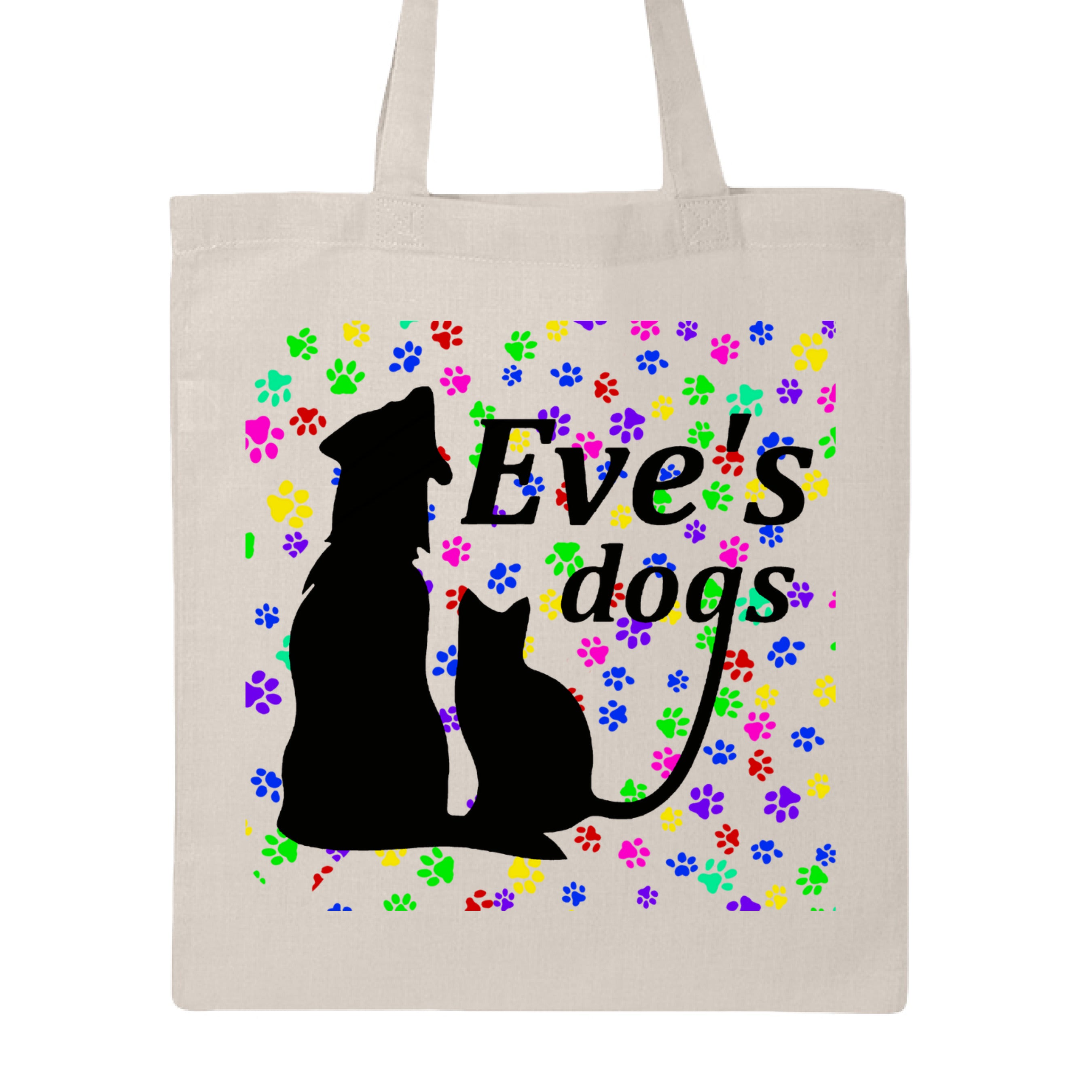 This is the Natural Paws on Paws Adopt Eve's Dogs Canvas Tote to help raise awareness and adopt. This is showcasing the front of the tote. There is an image of their logo which is in black writing of "Eve's Dogs". The "g" connects to the tail of the cat who is sitting next to the dog. Both are black shadows. The background is colorful paw prints which is bright green, blue pink, yellow and red. It is against a white background.
