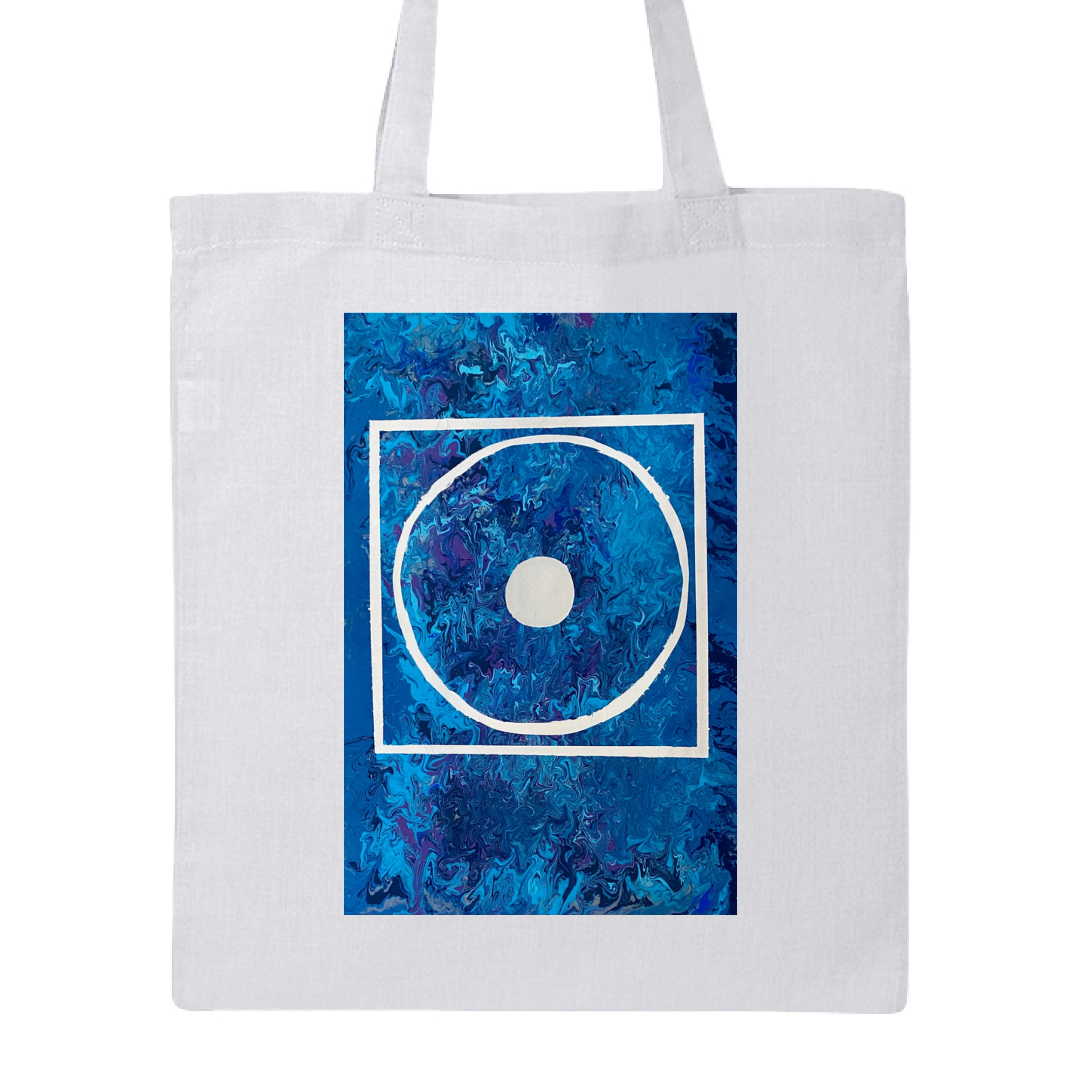 This is the White Big Low Canvas Tote by Storm Garden Studio. This is showcasing the front of the tote. The illustration is rectangular and has a white filled in dot, within a outlined circle, within a outlined rectangle. The background is a mix and dip of different blues. The tote is against a white background.