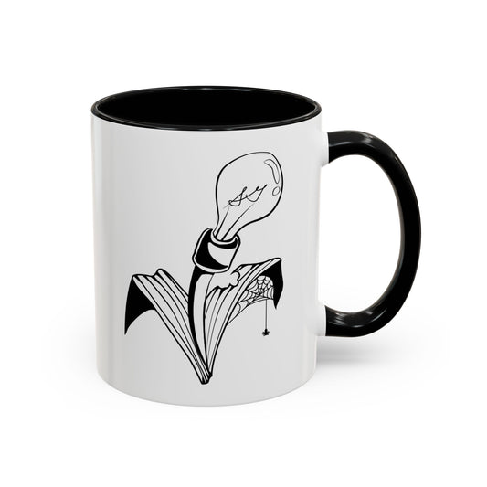 This is the Black 11oz Storm Garden Studio Accent Coffee Mug. This is an image from the front with the handle on the right. It is color matched with the inside of the mug. The Storm Garden Studio logo is printed in black and white in the middle. The logo is a lightbulb screwed onto a plant with two leaves. One leaf is bitten through, has a spiderweb and a spider. It is against a white background.