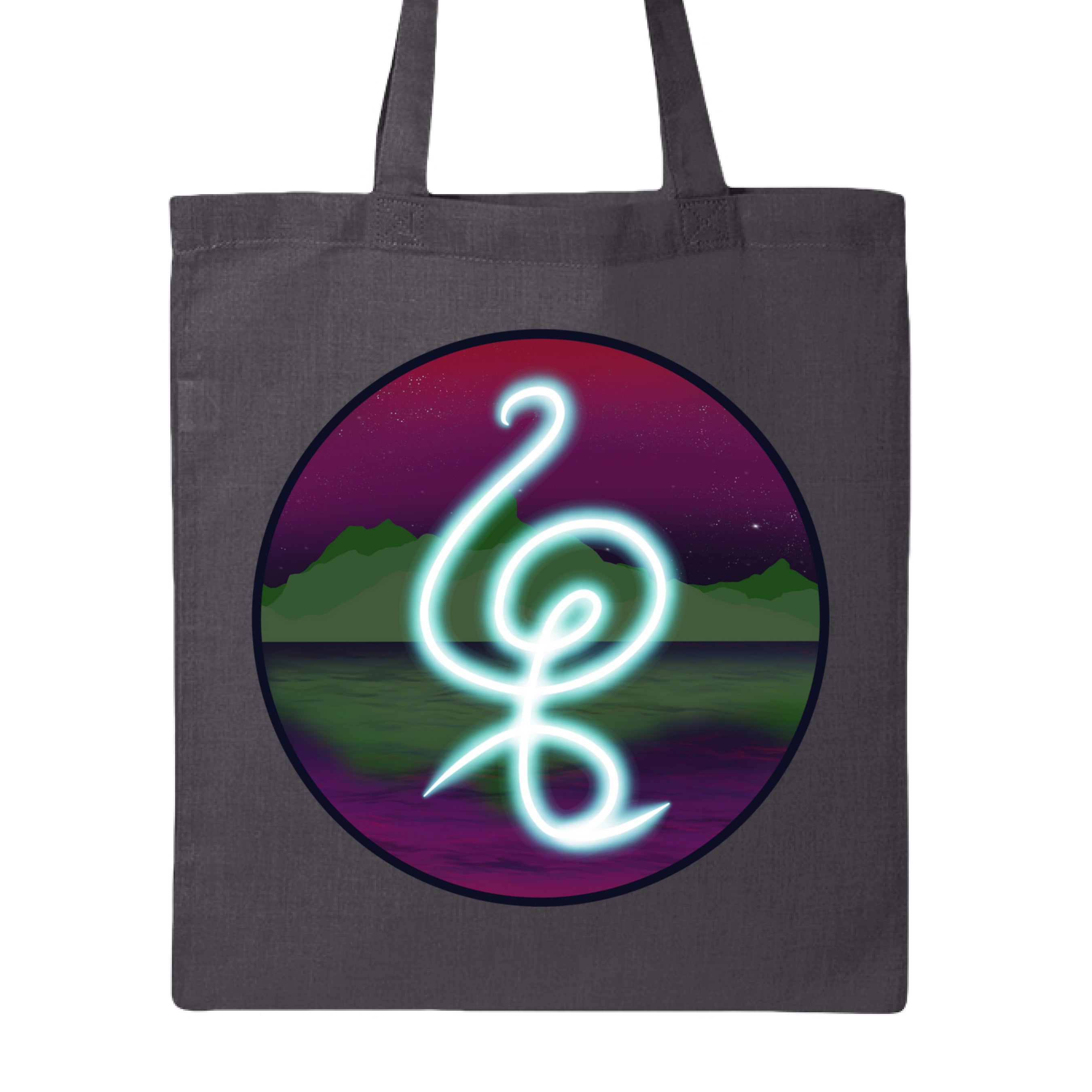 This is the Charcoal Hakuna Matata Canvas Tote by Lee Hansheng Studios. This is showcasing the front. The illustration is circular and has a glowing, freeform symbol in luminous turquoise against a cosmic horizon of deep purples and greens with twinkling yellow stars. It is against a white background.  