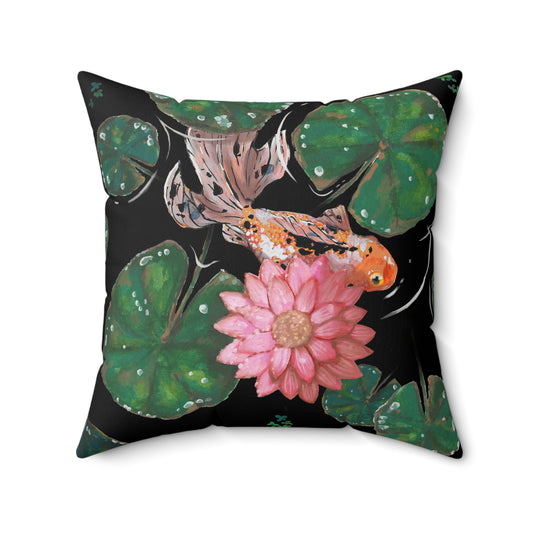 This is the 20" x 20" Goldfish Pillow by Chris Foster Design. This shows the front of the pillow. The illustration has the background in black, nine dark or light green lily pads, small foliage, one orange, white and black goldfish and a pink blooming flower. The print is on both sides of the pillow. The pillow is against a white background.