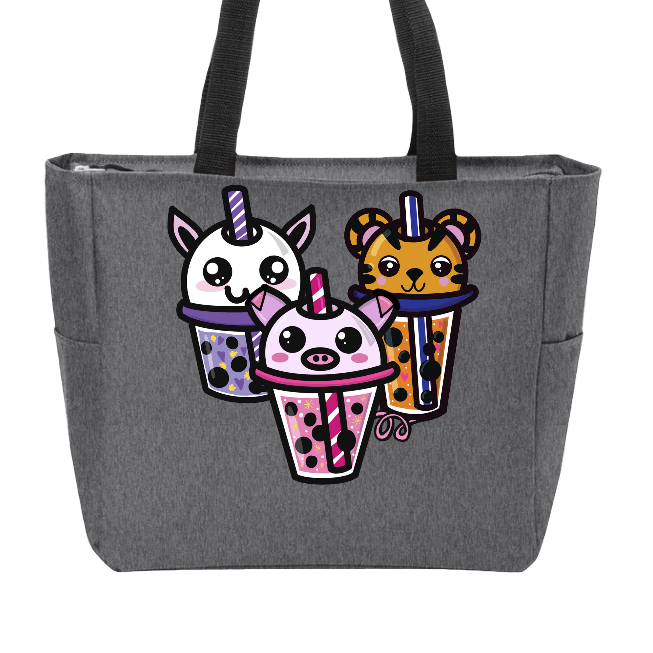 This is the Heather Grey Boba Friends Zip Tote by Dazzle & Daggers Design. This is showcasing the front that features three kawaii designs.The Piggy Boba is pink all over and the glass has pink liquid, boba, yellow sparkles,white dots and peppermint swirl like. Thai Tea Tiger is orange, orange liquid, black boba, white dots, red hearts, blue and white striped straw. The Cryptid Boba is white, purple and white swirl straw, purple liquid, black boba, yellow stars and purple hearts. The handle is black.