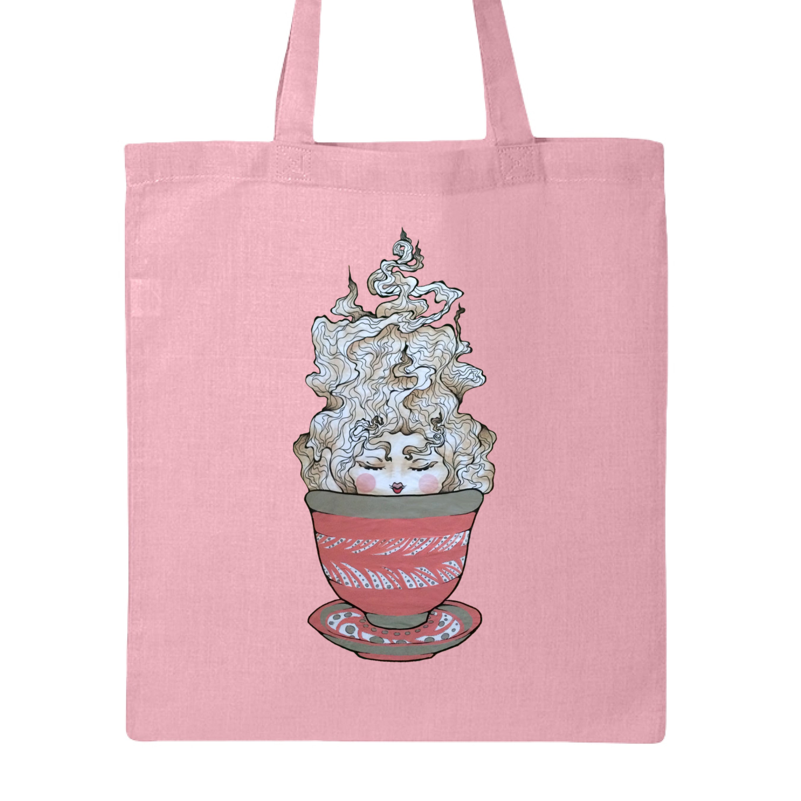 This is the Light Pink Green Tea Canvas Tote by Chris Foster Design. This is showcasing the front of the tote. The illustration is a tea sprite. There's a woman's face with curly hair/steam that is white and tan/beige inside an intricately designed pink/red teacup with a saucer that has white and black dashes or swirl patterns. The tote is against a white background. 