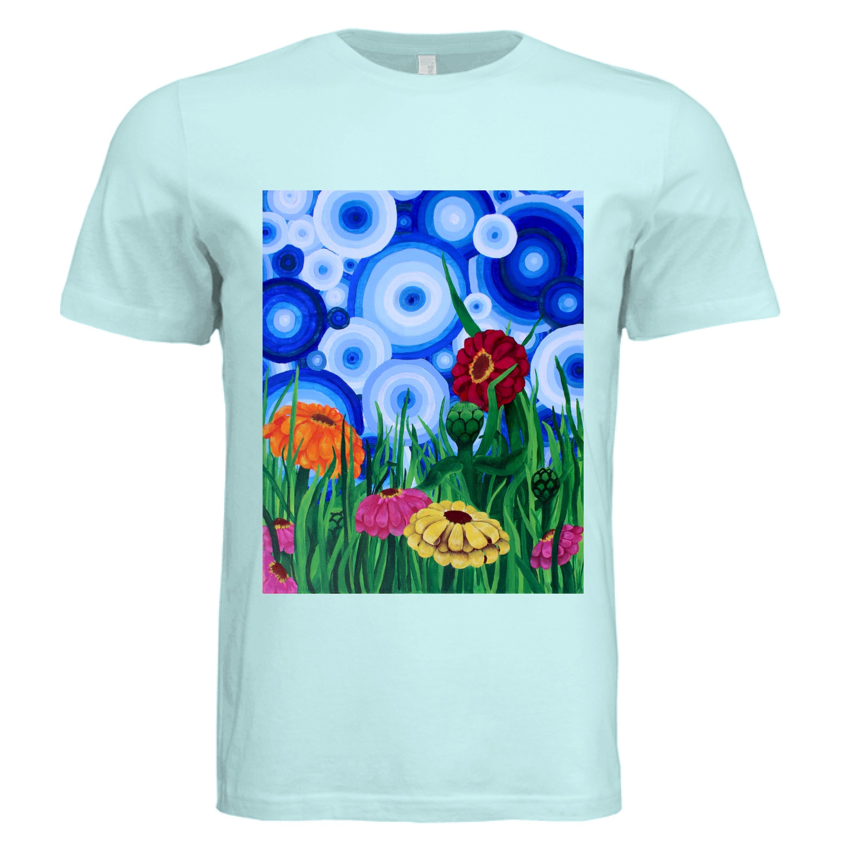 This is the Mint Zinnia 2 T-Shirt by Storm Garden Studio. This showcases the front of the shirt. The rectangular illustration are bold and color zinnias like red, yellow and orange across tall green grass. The background has many different circles in blue, dark blue and white. The shirt is against a white background.