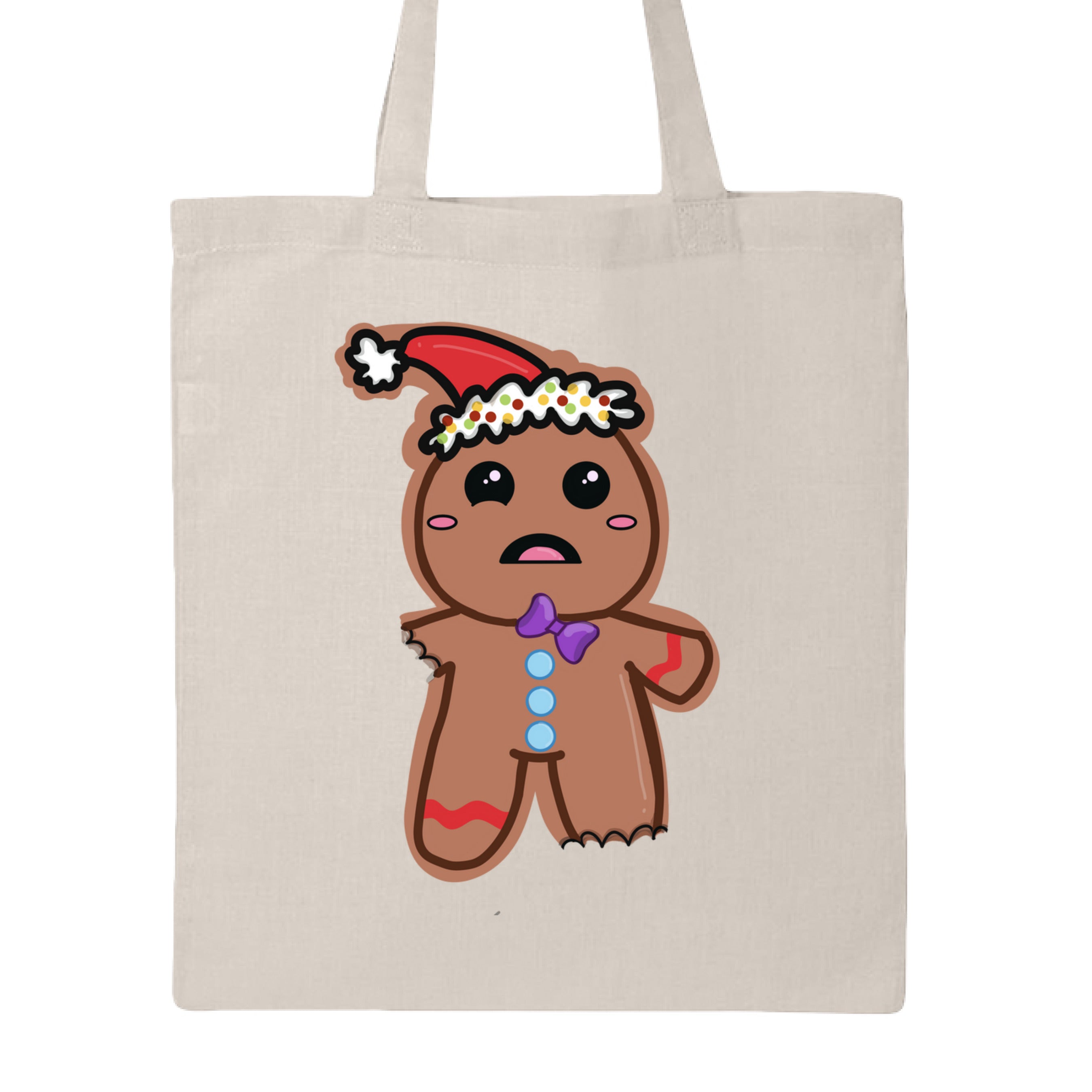 This is the Natural Ginger Bread,Ginger Dead Canvas Tote by Dazzle & Daggers Design.This is showcasing the back of the tote.The illustration is of a brown ginger bread who is wincing in pain.The left leg and right leg have been bitten off.It's wearing a santa hat with a white puff on the tip and around the hat.The puff around the hat is polka dotted with yellow,red and green.Gingerbread has oval pink cheeks,open mouth,pink tongue,slanted purple tie,three light blue bottons through the middle of the body.