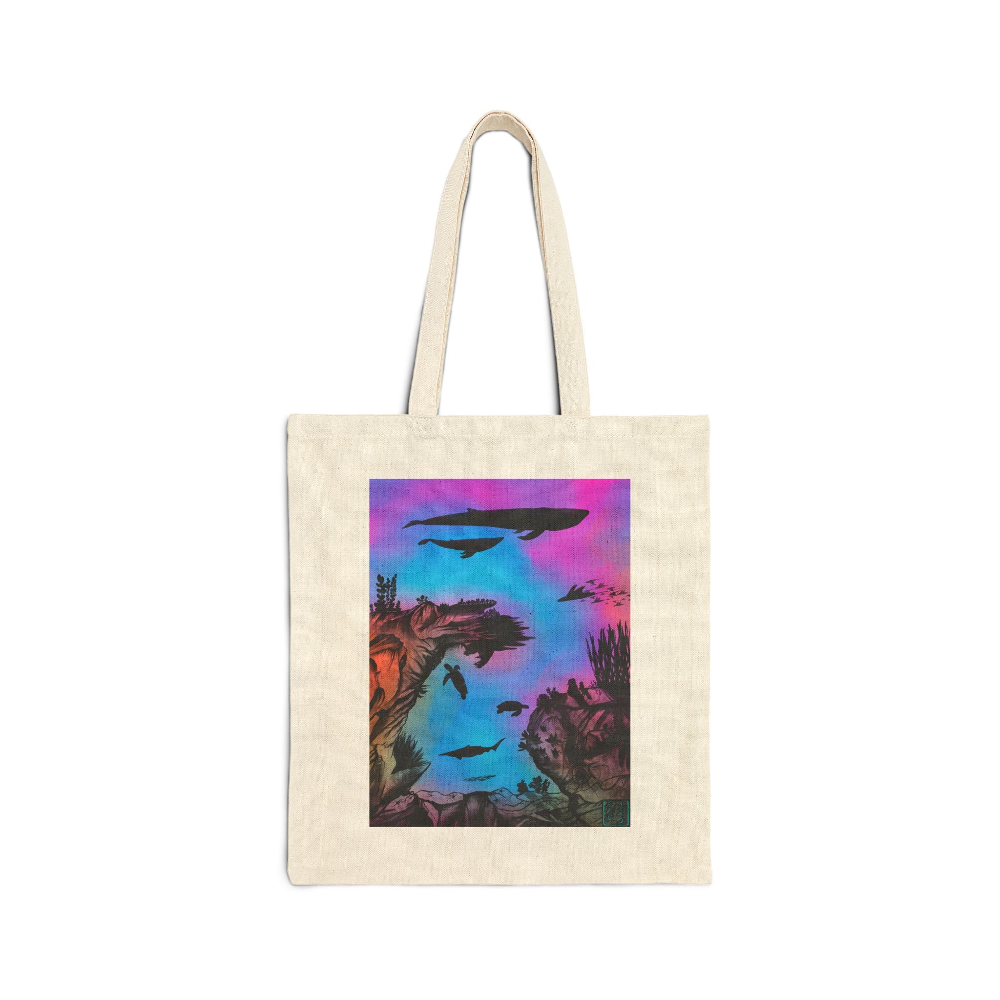 This is the Natural Into the Abyss Canvas Tote by Lee Hansheng Studios.The image is from the front. The illustration is underwater seascape with aquatic plants on a marbled background.There are two blue whales,1 goblin shark,school of eagle rays,two sea turtles and a school of fish.On the bottom right corner where the front patch of the backpack there is the studio logo printed in black outlined in blue.The colors are pink,purple,blue and red/orange. It is against a white background. 