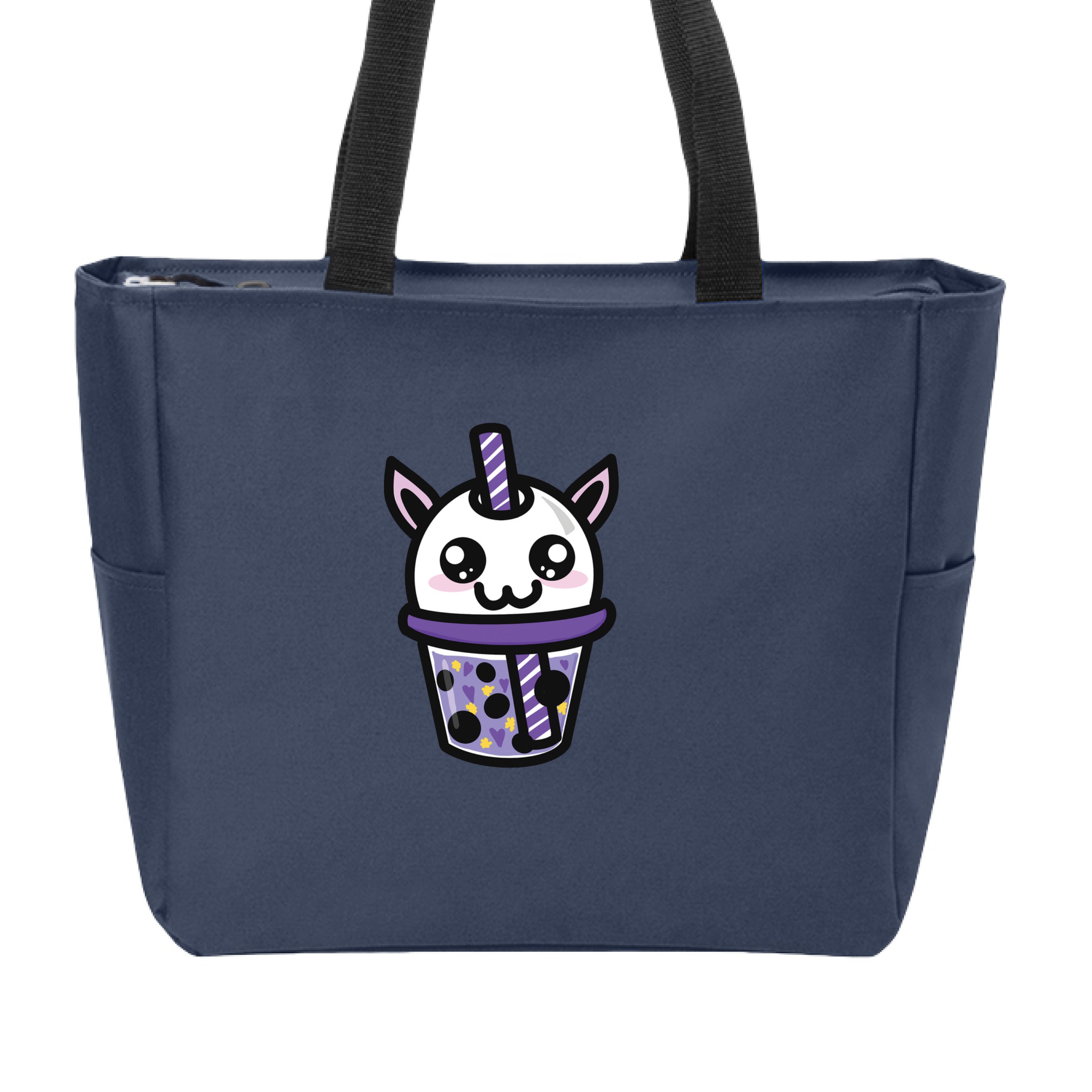 This is the Navy Cryptid Boba Zip Tote by Dazzle & Daggers Design. This is showcasing the front and the handles are black. The Cryptid Boba is white, has cute light pink oval cheeks under big black and white sparkly eyes. It's mouth is in the shape of the number 3, purple and white swirl straw. In the glass is purple liquid, black boba, yellow stars and purple hearts. The tote is against a white background.