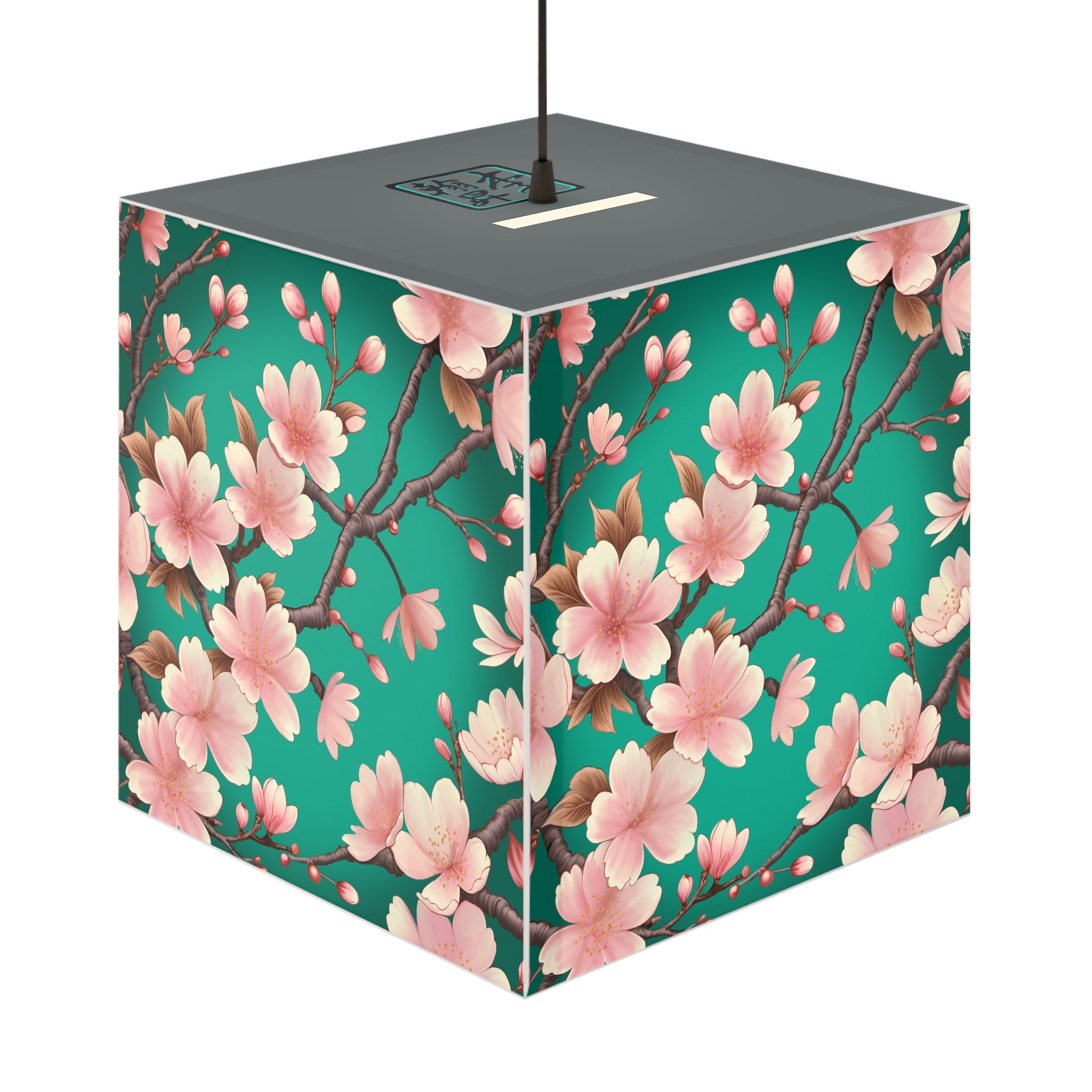 This is the Standard Sakura Light Cube Lamp by Lee Hansheng Studios. The illustration is all around has a blue/teal background, 3-4 thin dark wood branches with pink/light pink buds on each stem. There are blooming and already flowered sakuras on each branch. There is about 3-4 inches between the end of the illustration and the sides of the lamp. It inclused plug for US or EU outlets. The cube lamp is shown hung up. The gray top can be seen with the logo where the cord is being hung.