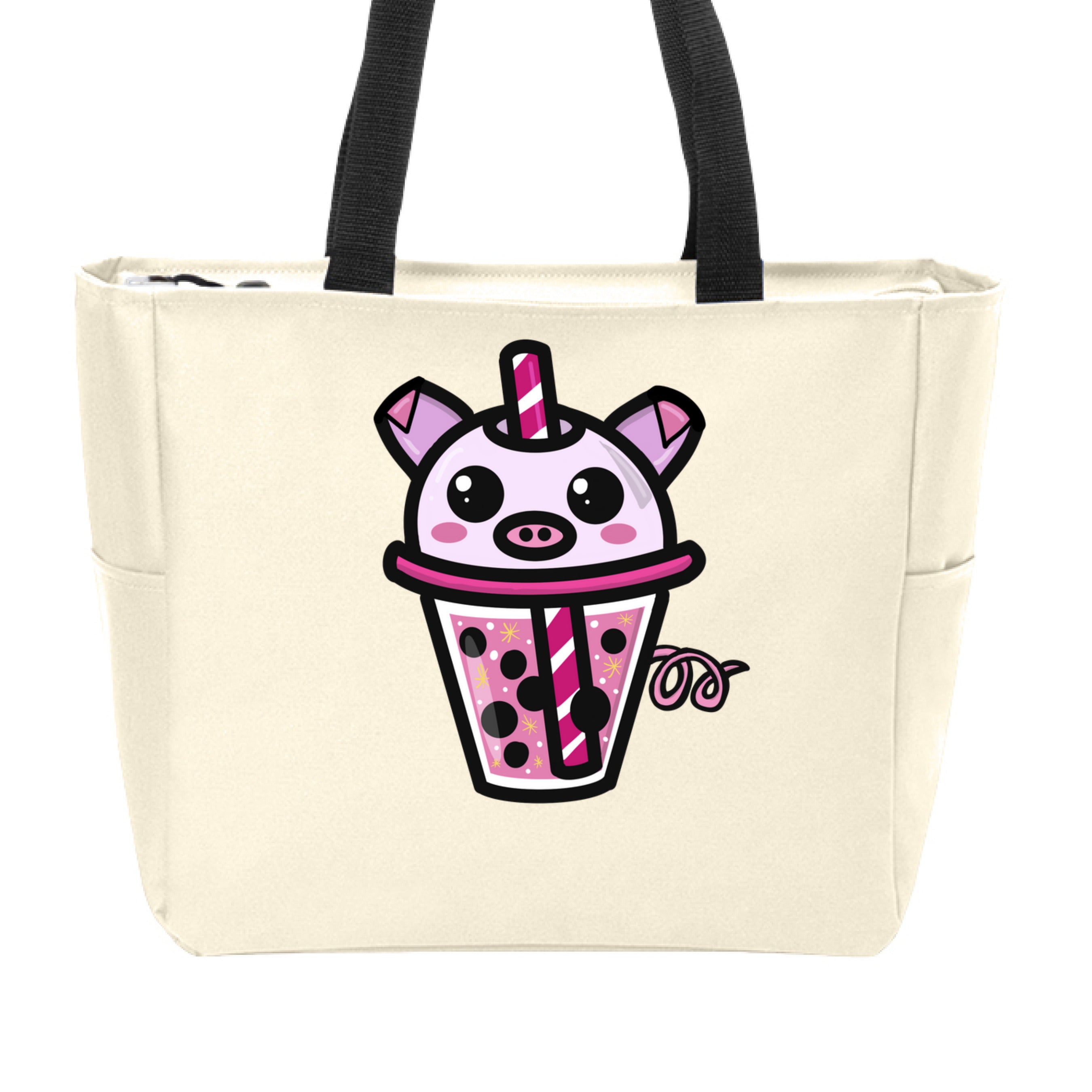 This is the Stone Piggy Boba Zip Tote by Dazzle & Daggers Design. This is showcasing the front of the tote. The handles on the zip tote are black. The Piggy Boba is pink all over, cute snout, oval cheeks, pig ears and tails, glistening eyes and the glass has pink liquid, boba, yellow sparkles, white dots and peppermint swirl like straw. It is against a white background.