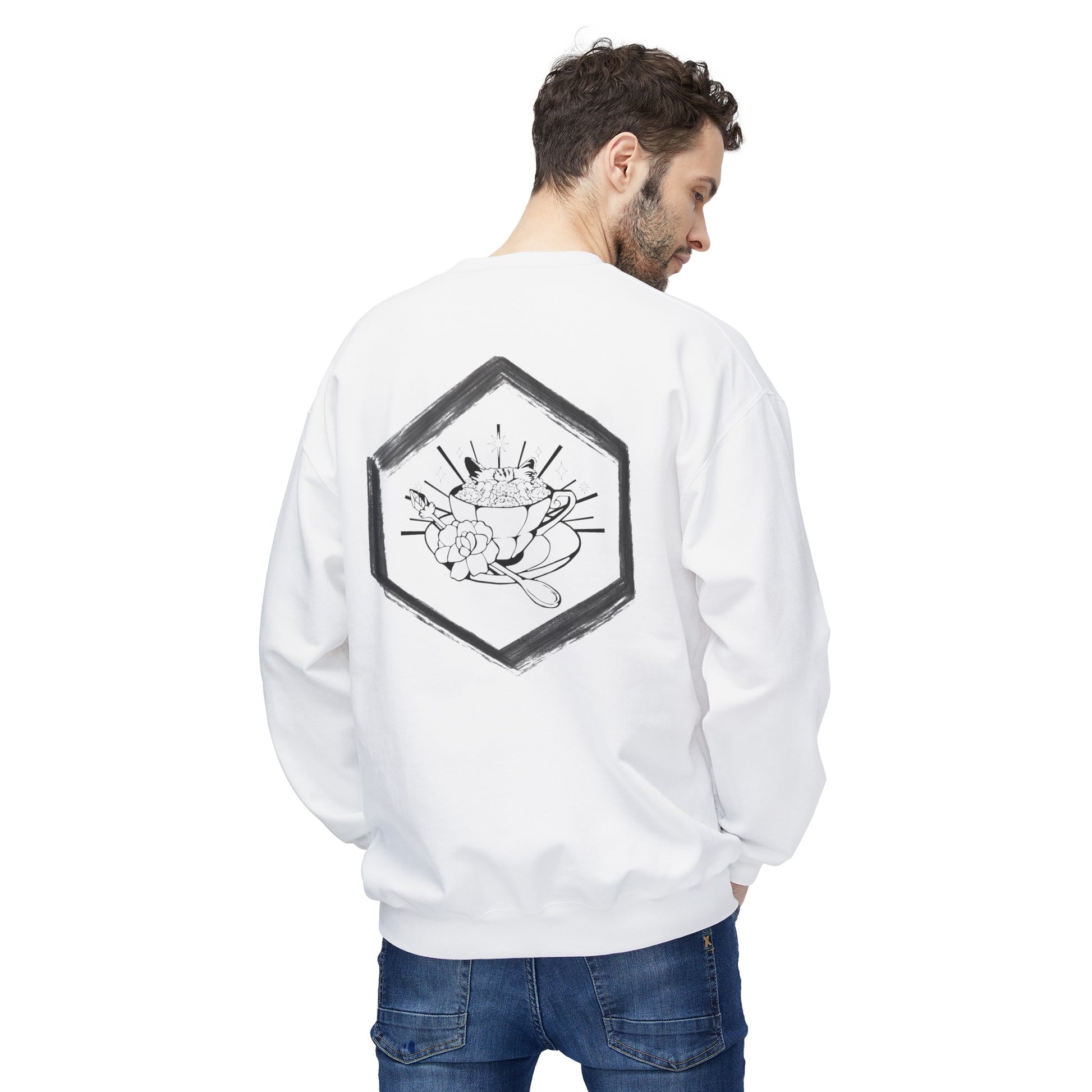 This is the White Ah, Hex Crewneck by Tidy Tea Witch. This showcases the back where the studio's logo is near the upper to middle back of the crewneck,white a black with hand painted like features on the border.In the middle is a teacup,a saucer and crystal spoon.There's a large flowering covering the spoon,flowers filling it to the fullest,stars and lines exploding in the background and cat ears popping out of cup. A man is looking over his right shoulder facing the back with hands in his jeans pockets. 