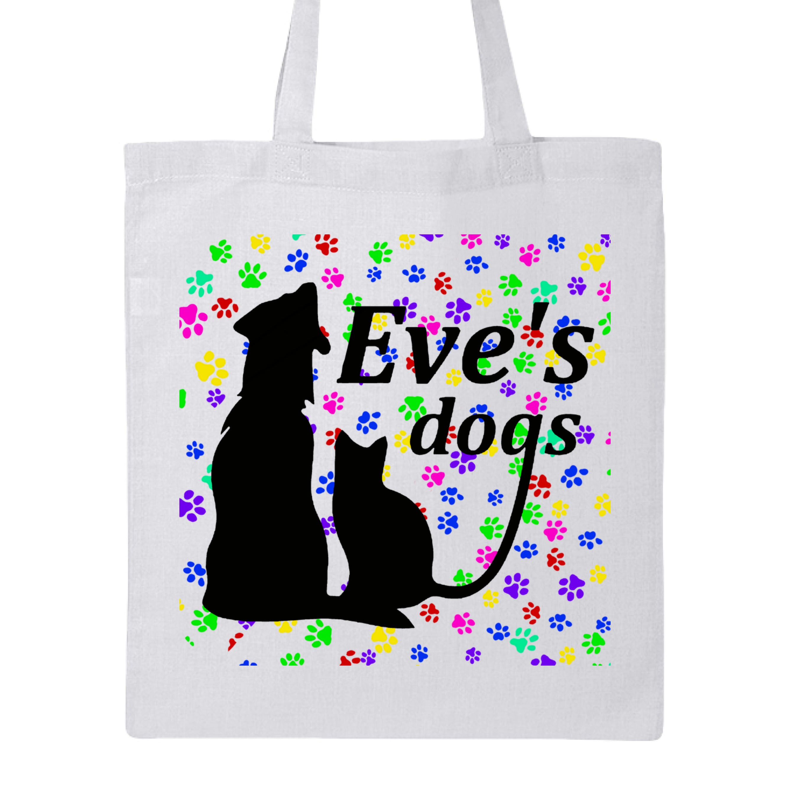 This is the White Paws on Paws Adopt Eve's Dogs Canvas Tote to help raise awareness and adopt. This is showcasing the front of the tote. There is an image of their logo which is in black writing of "Eve's Dogs". The "g" connects to the tail of the cat who is sitting next to the dog. Both are black shadows. The background is colorful paw prints which is bright green, blue pink, yellow and red. It is against a white background.